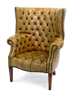 A George III Style Nail-Studded Tufted Brown Leather-Upholstered Mahogany Wing Armchair