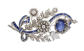 * A White Gold, Star Sapphire, Sapphire and Diamond En Tremblant Brooch, 23.80 dwts.