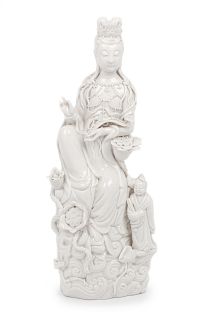 A Blanc-de-Chine Porcelain Figure of Guanyin
Height 12 1/2 in., 32 cm.