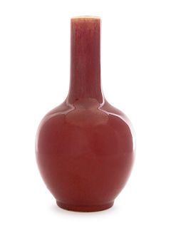 A Sang-de-Boeuf Glazed Porcelain Bottle Vase
Height 9 3/4 in., 25 cm. 