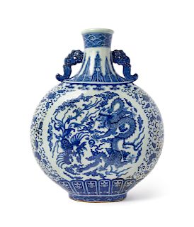 A Large Blue and White Porcelain 
Dragon and Phoenix
 Moon Flask
Height 18 x 13 1/2 in., 45 x 34 cm.