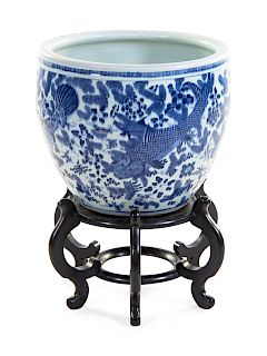 A Large Blue and White Porcelain Fish Bowl
Height 18 3/4 x diam 22 in., 48 x 56 cm. 