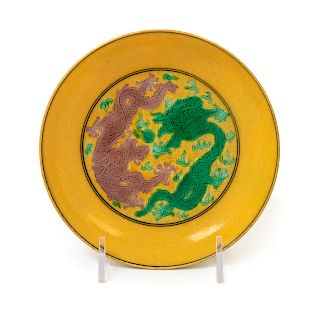 A Yellow Ground Green, Aubergine and Black Decorated Saucer Dish
Diam 5 1/4 in., 13 cm. 