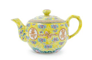 A Famille Jaune Porcelain Covered Teapot
Height 4 1/2 in., 11 cm. 