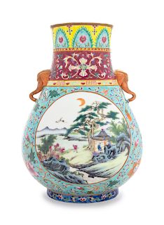 A Famille Rose Porcelain Zun Vase
Height 13 5/8 in., 35 cm. 