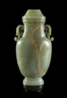 A Large Celadon Jade Covered Vase
Height 10 3/4 in., 28 cm. 