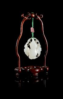 A White Jade 'Gourd' Pendant
Height 2 in., 5 cm. 