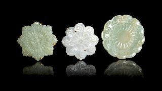 Three Celadon Jade Floriform Pendants
Widest: width 2 1/2 in., 6 cm. 