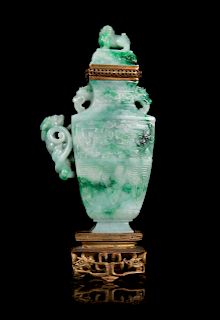 A Mottled Green Jadeite 'Dragon' Covered Vase
Overall: height 8 3/8 in., 21 cm. 