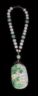 A Jadeite Beaded Necklace
Length 15 1/4 in., 39 cm. 