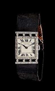 An Art Deco Platinum, 18 Karat Yellow Gold and Diamond Wristwatch, Cartier, France, 19.10 dwts.