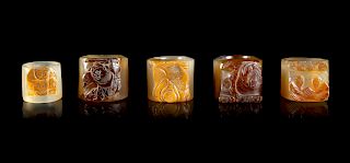 Five Carved Agate Archer's Rings
Largest Interior: diam 0 7/8 in., 2 cm. Largest Overall: diam 1 1/2 in., 4 cm. 