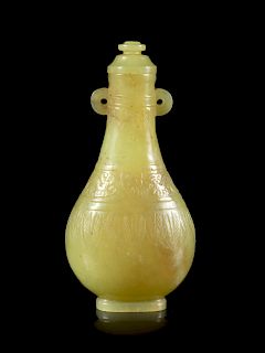A Yellow Jade Snuff Bottle
Height 2 3/4 in., 7 cm. 