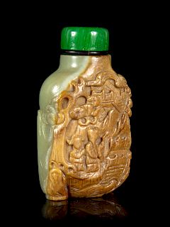 A Carved Russet and Celadon Jade Snuff Bottle
Height 2 1/4 in., 6 cm. 