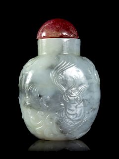 A Carved Grey and White Jade Snuff Bottle
Height 2 1/4 in., 6 cm. 