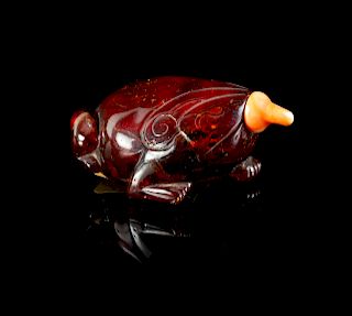 An Amber Frog-Form Snuff Bottle
Height 2 1/2 in., 6 cm. 