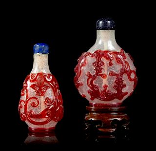 Two Red Overlay 'Snowflake' Ground Glass 'Chilong' Snuff Bottles
Larger: height 2 3/8 in., 6 cm. 