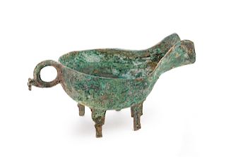 A Bronze Ritual Pouring Vessel, Yi
Height 3 3/4 in., 10 cm. 