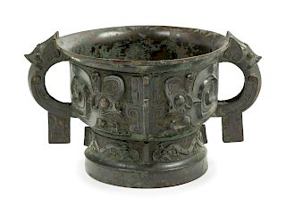An Archaistic Bronze Food Vessel, Gui
Height 5 5/8 x width 9 1/2 x diam 7 7/8 in., 14 x 24 x 20 cm. 