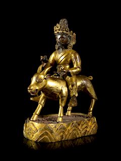A Sino-Tibetan Gilt Bronze Figure of Garwa Nagpo
Height 6 1/8 in., 16 cm.