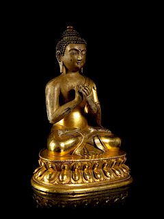 A Sino-Tibetan Gilt Bronze Figure of Buddha
Height 6 3/4 in., 17 cm. 
