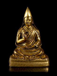 A Sino-Tibetan Gilt Bronze Figure of Gelukpa Lama
Height 7 1/2 in., 19 cm. 