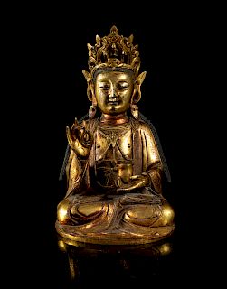 A Gilt Bronze Figure of Guanyin
Height 10 1/4 in., 26 cm. 