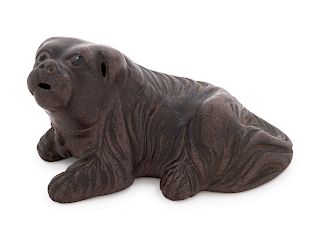 A Yixing Pottery Figure of a Recumbent Dog
Length 4 in., 10 cm.