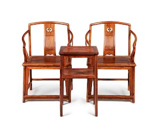 A Set of Huanghuali Armchairs and Side Table
Chair: height 38 x length 24 x width 18 1/2 in., 96.5 x 61 x 47 cm.