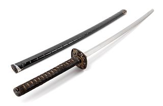 A Japanese Katana
Blade length 28 1/2 in., 72 cm. Overall length 39 1/8 in., 99 cm, 