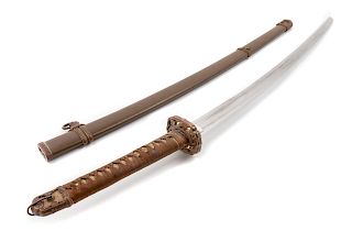 A Japanese Katana
Blade length 27 in., 69 cm. Overall length 39 in., 99 cm.