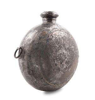 A Large Indonesian Hammered Metal Vessel
21 x 10 x 19 in., 53 x 25 x 48 cm.