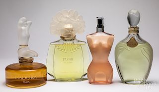 Four glass store display factice perfume bottles