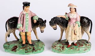 Pair of Staffordshire figures of a boy and girl