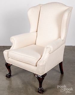 Chippendale style carved mahogany wing chair.
