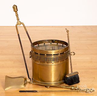 Brass bucket, together with a group of fire tools