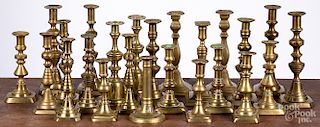 Large collection of brass candlesticks