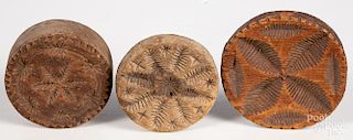 Three carved butterprints