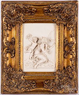 Carved marble plaque of a maiden and cherub, etc.