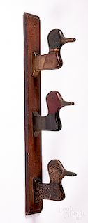 Carved and painted duck head wall rack