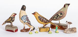 Four carved and painted songbirds, etc.