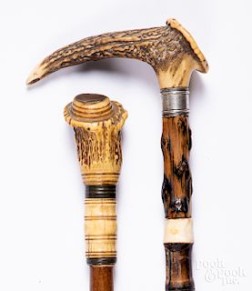 Two stag handle walking sticks