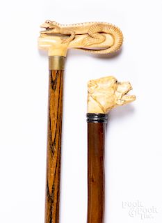 Two carved bone walking sticks
