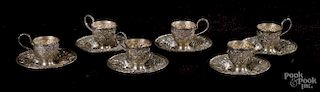 Six sterling silver demitasse cups and saucers