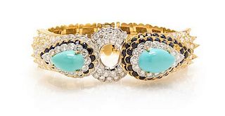 * A Vintage Two Tone Gold, Turquoise, Diamond and Sapphire Bracelet, 43.80 dwts.