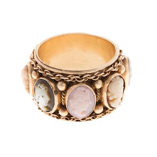 A Ladies Wide Carved Cameo Eternity Band in 14K