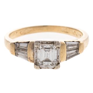 A Ladies Emerald Cut Diamond Engagement Ring