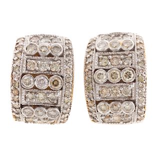 A Ladies Pair of Wide Diamond Earrings in 14K