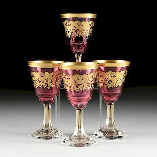 A SET OF FOUR BACCARAT STYLE GILT OVERLAY CRANBERRY TO CLEAR GOBLETS, CIRCA 1900,