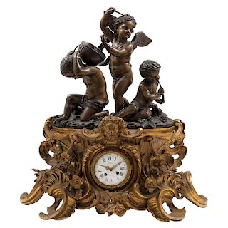 MANTEL CLOCK. FRANCE, 19TH CENTURY. Louis XV Style. Golden bronze with patina. Brand in the clock's cover. 